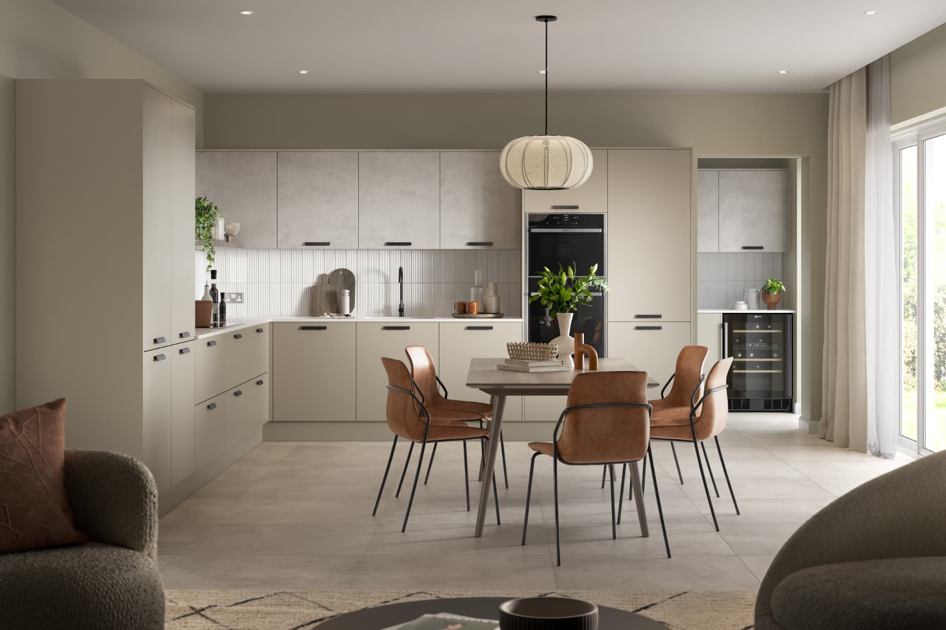 Fossil-toned kitchen with light Artstone worktops and tall storage