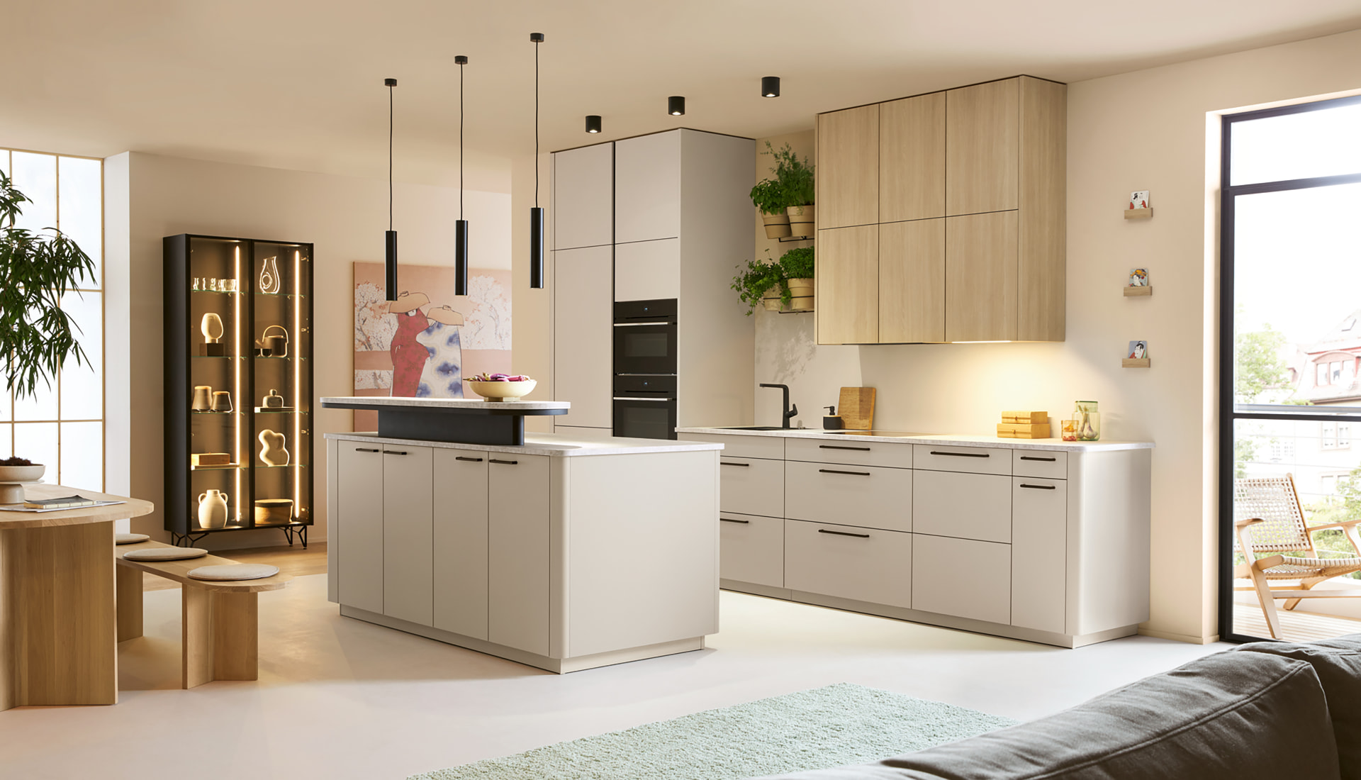 Completed kitchen and living space in a managed Studio Seven project, with island seating and full-height storage