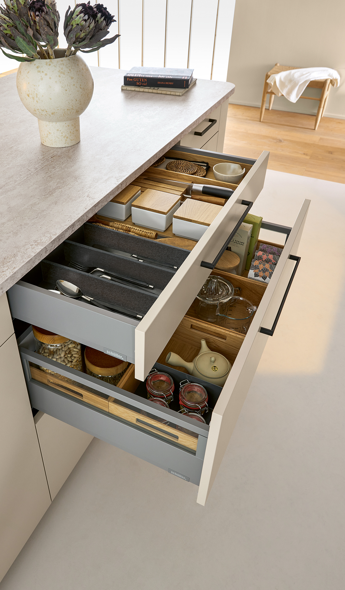 Pull-out kitchen storage drawer with organised interior fittings