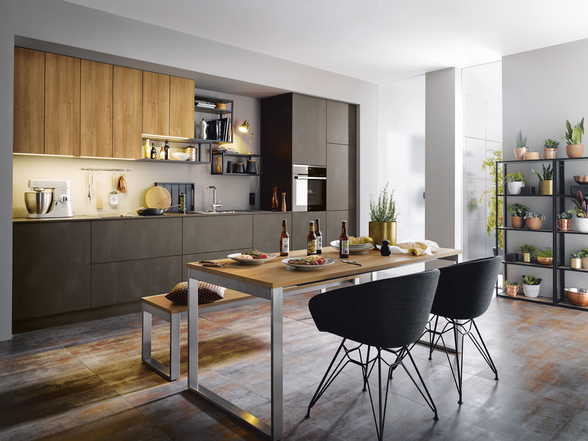 Kitchen with bar seating, wall panelling and integrated lighting